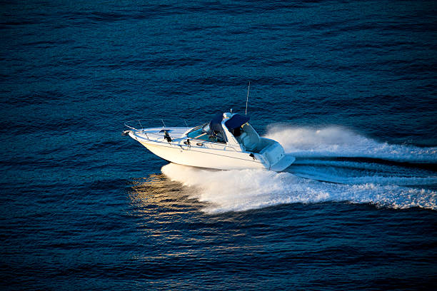 Luxury Powerboat Luxury powerboat aerial view. fast boat stock pictures, royalty-free photos & images
