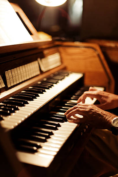 Hands playing church organ