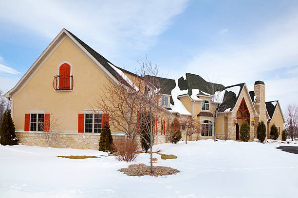 istock Large Mansion Home In Winter With Red Accents 183783403