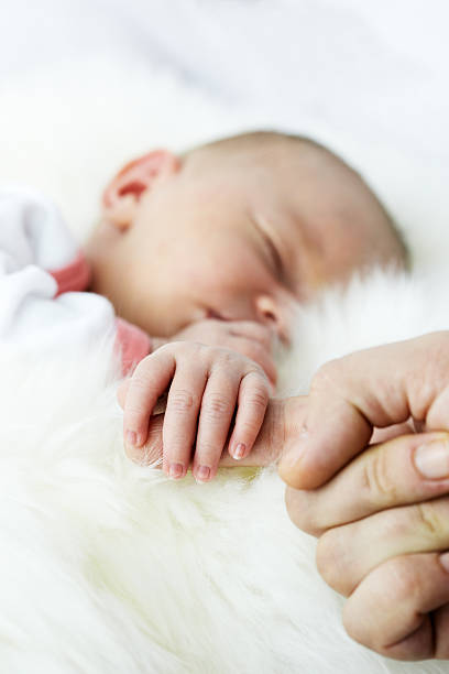istock Holding  mothers finger 183783491