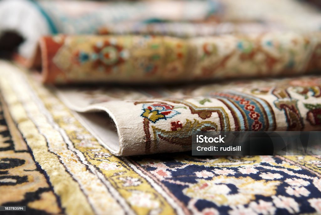 Persian Carpets Selective focus image of Persian silk rugs Rug Stock Photo