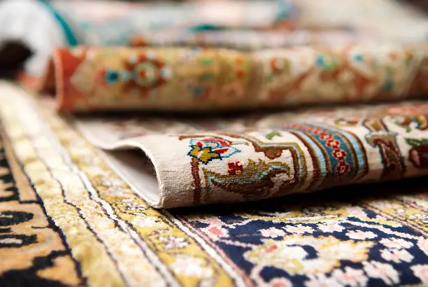 Selective focus image of Persian silk rugs
