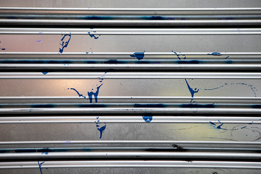 Paint splatters on a metal surface