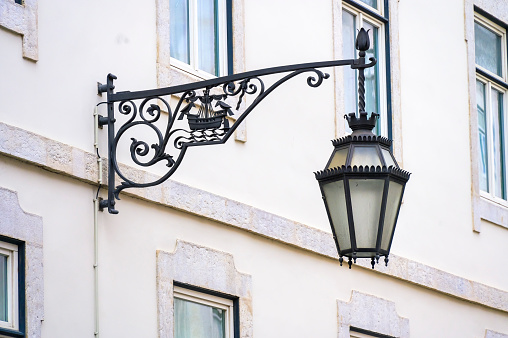 Old fashioned street lamp during rain in the dark