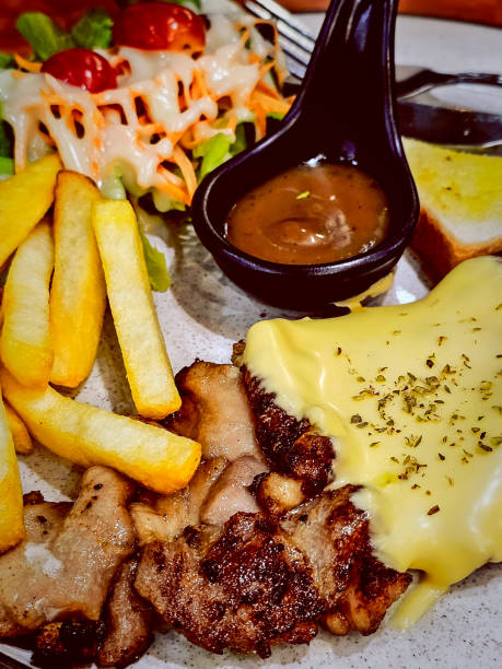 istock pork steak Served with french fries, salad and bread. 1837856460