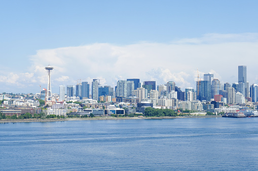 One sailboat against the Seattle, Washington skyline.
