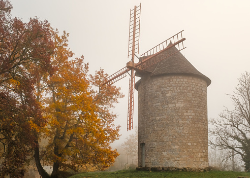 Mist surrounds the Moulin de Domme, an ancient windmill in the village of Domme in the Dordogne region of France
