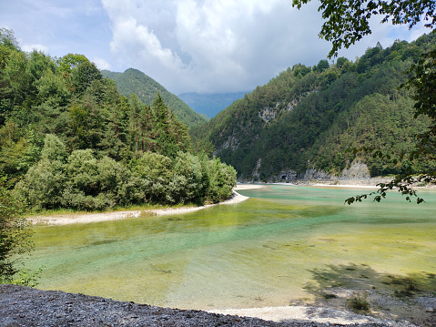 View of natural greenish lake in the Belluno mountains