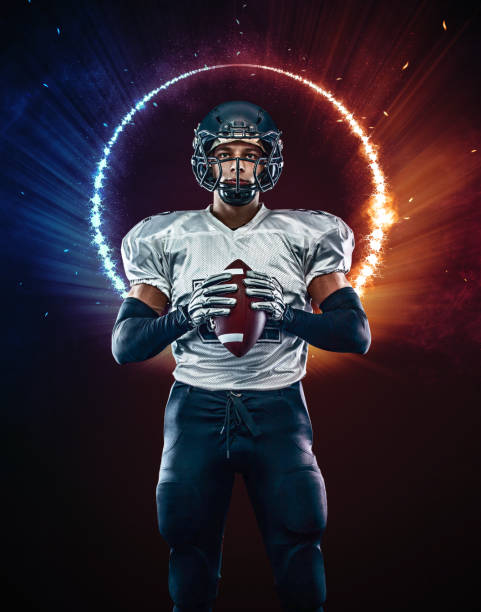 istock American football player black background with fire 1837911701