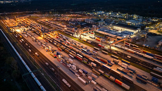 Railyard, freight yard and freight trains at dusk - aerial view