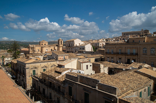 Panoramic picture of the Arles Amphitheater  on a sunny day with a dramatic sky.