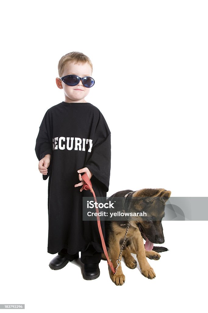 Little Security Guard A cute three year old security guard with his guard dog isolated on white. Bouncer - Security Staff Stock Photo