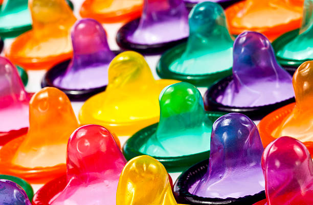 Condoms in Colors Arrangement of condoms in bright colors condom photos stock pictures, royalty-free photos & images