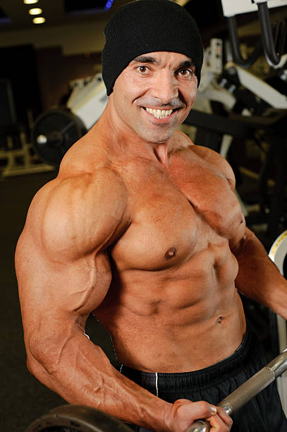 istock Muscular Man Exercising in the gym 183792487
