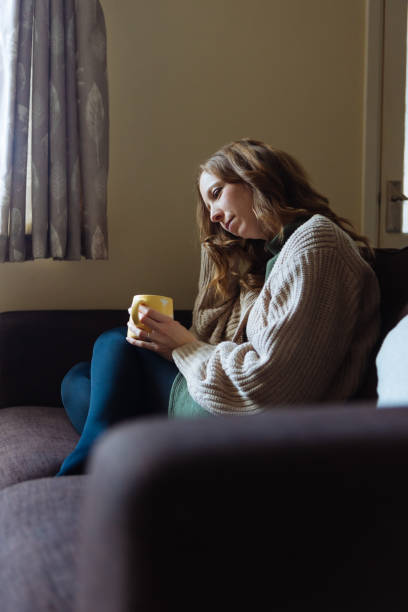 istock Woman drinking coffee at home 1837927493