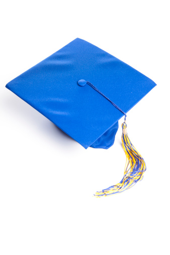 Blue graduation hat isolated on white background