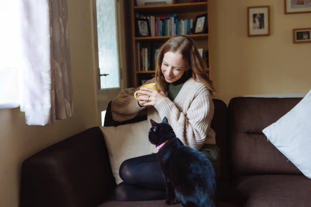 istock Woman loving black cat 1837929761