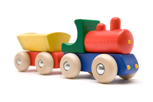 Colorful toy train isolated on a white background.