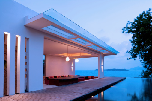 Villa In The Tropics On the Ocean Coast Of An Island With An Infinity Pool And View Out To Sea.