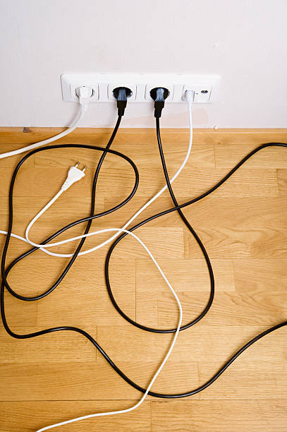 istock Plugs connected to the outlet in a wall 183794243