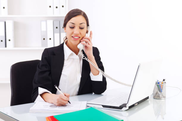 istock Beautiful young woman working in office 183794332