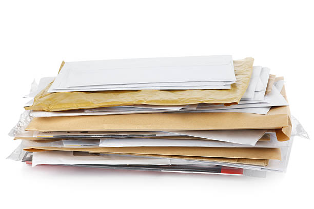 Post "Pile of post. Envelopes, magazines etc isolated on white with shadow" junk mail photos stock pictures, royalty-free photos & images