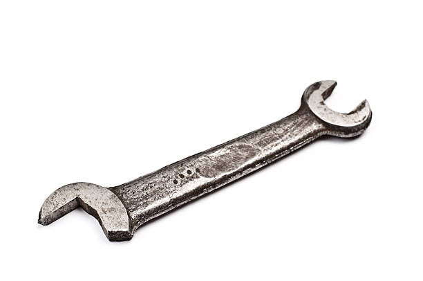 Broken tarnished wrench isolated on white stock photo