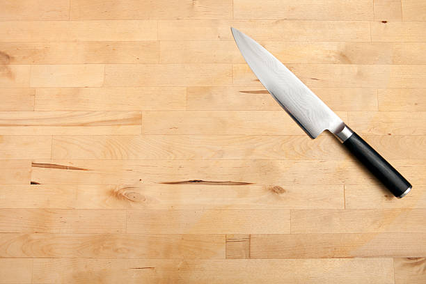 istock Chefs Knife on Wood Cutting Board 183795585