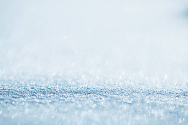 natural winter background, fresh fluffy snow, sun glare, bokeh