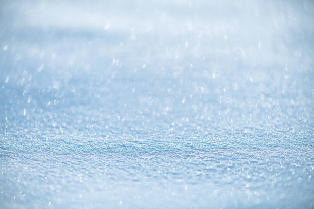 natural winter background, fresh fluffy snow, sun glare, bokeh