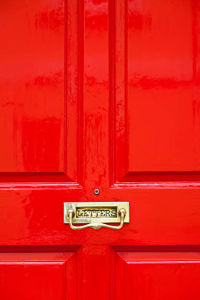 istock Bright red painted door with brass letterbox 183795812