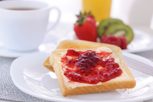 Strawberry jam and bread on breakfast table - XXXL image