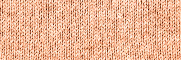 istock Knitted peach color color background 1837961157