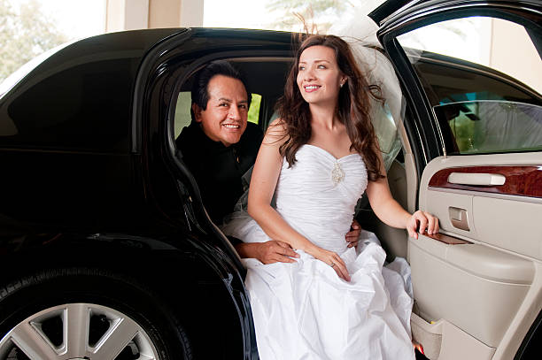istock Bride and Groom getting out of a car 183796405