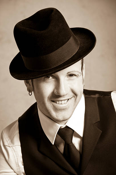 istock Portrait of a young smiling man with hat 183796812