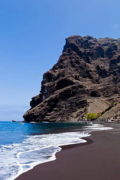 The remote beach of Masca can be reached by ferry or with a spectacular but challenging footpath from the tiny village of Masca, in the Teno mountains, northwest of Tenerife. The trail passes though a rocky gorge with a beautiful wild scenery. Tenerife, Canary Islands. 