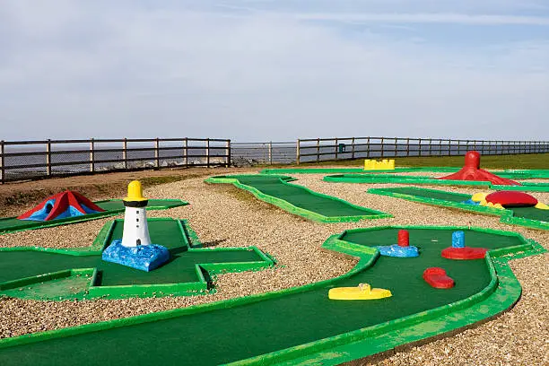 "Typical colourful miniature golf course at a seaside tourist resort. Doniford Bay, UK."