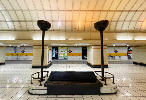 London, UK - June 26, 2018: Underground tube metro with moving blue red subway train in Pimlico on platform station to Victoria