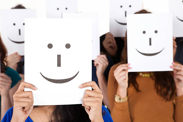 Happy People Holding Smiling Face Signs.See more from this series: