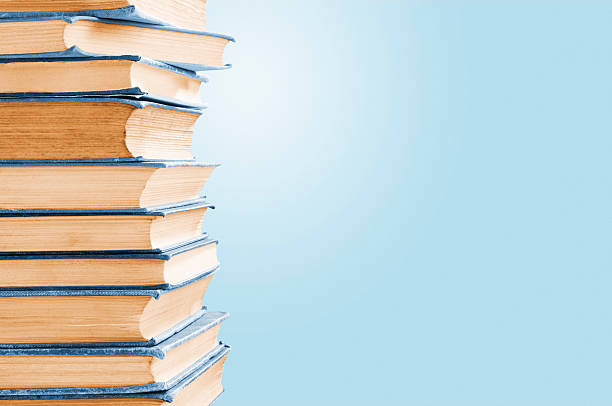 istock Pile of old blue leather covered books with copy space 183797706