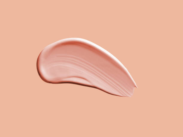 istock Liquid foundation on champagne nude background 1837977570