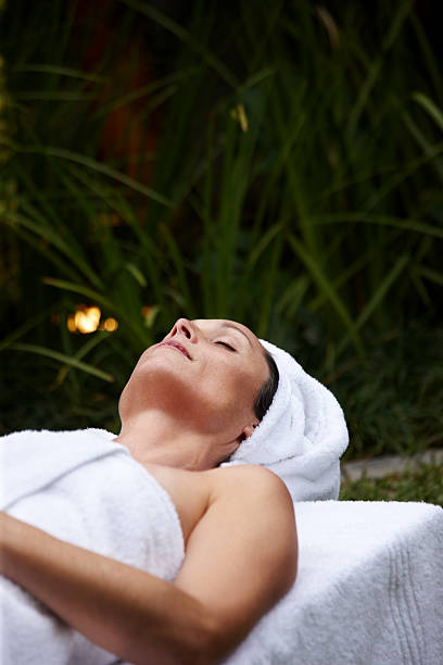 istock Beautiful middle aged woman in spa center 183797833