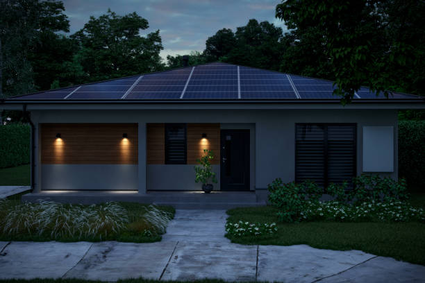 istock Modern House With Solar Panels And Wall Battery For Energy Storage At Night 1837979021