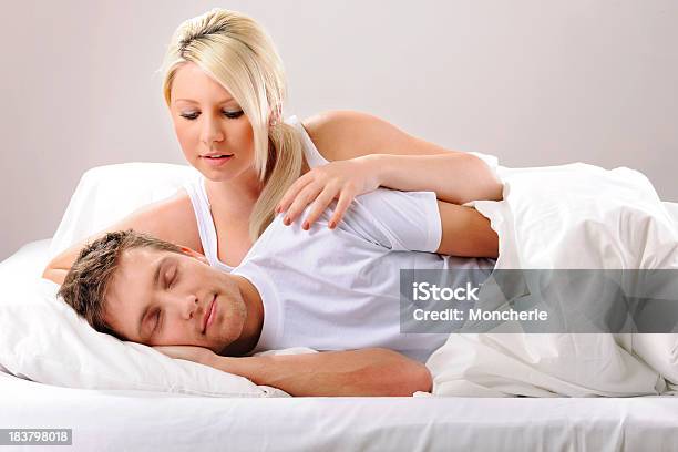 Young Woman Waking Up Her Partner Stock Photo - Download Image Now - 20-24 Years, 20-29 Years, Adult