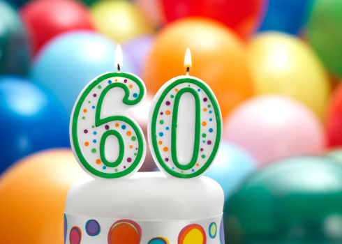 cake with 60 and balloon background