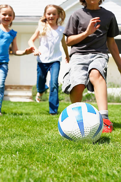 istock Children playing football 183798174