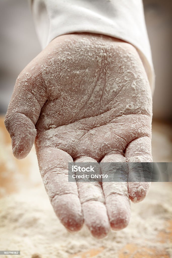 Baker's Hand A baker's hand covered with flour. Shot with shallow depth of field. A Helping Hand Stock Photo