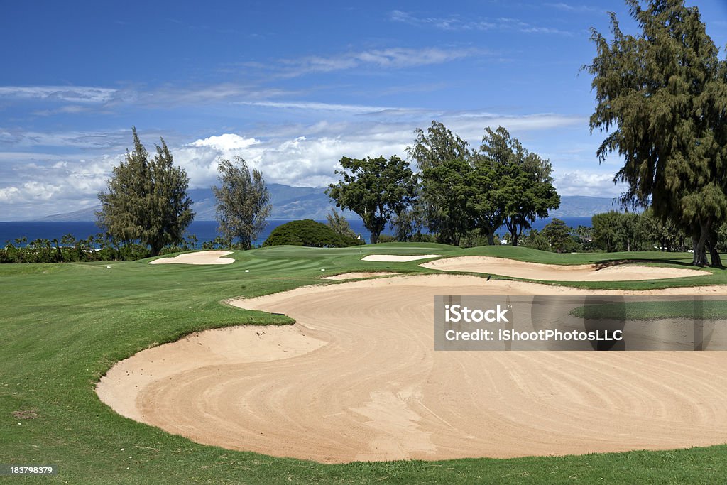 Big Sand Trap A large sand trap protects the green at this beautiful Maui golf course that overlooks the Pacific Ocean and the Island of Molokai ... Golf Course Stock Photo
