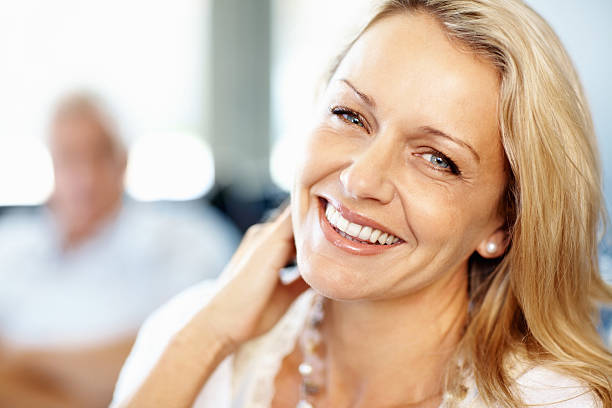 istock Cute, mature woman smiling 183798488