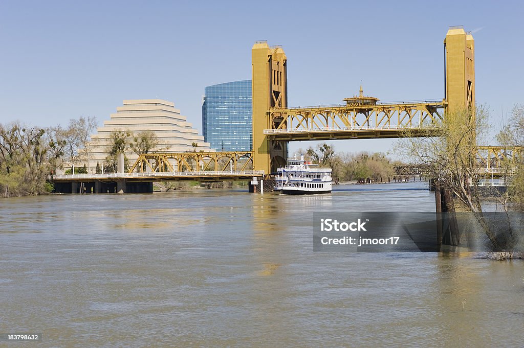 Riverboat under Bridge "This Riverboat traveling under the Tower Bridge in Sacramento California, this is a vertical lift bridge." Bridge - Built Structure Stock Photo